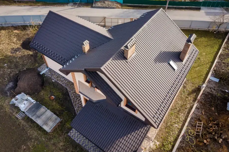 Aerial view of house with a metal roof